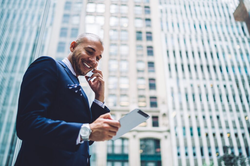happy businessman phoning for consultancy about roaming service