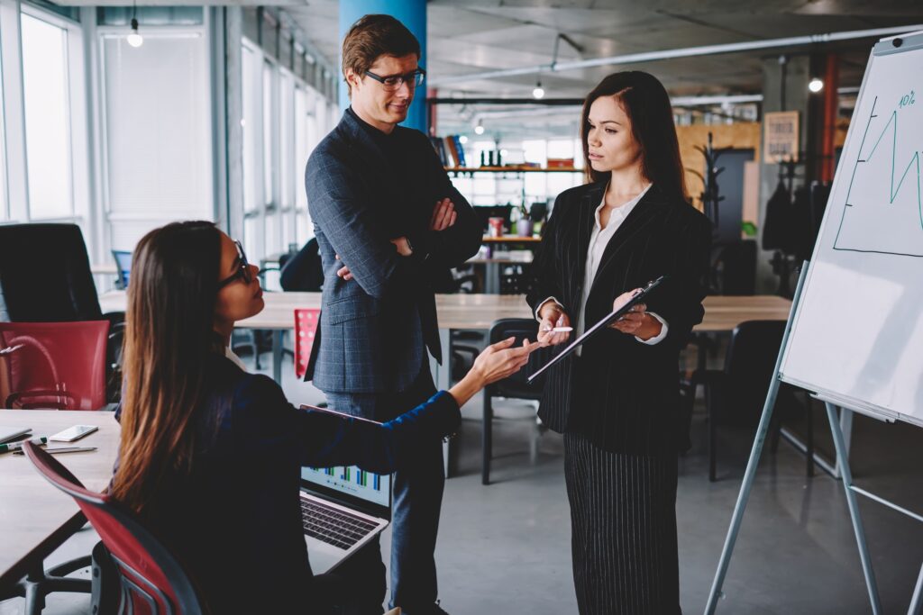 Young crew of male and female colleagues consultancy during productive work in business company